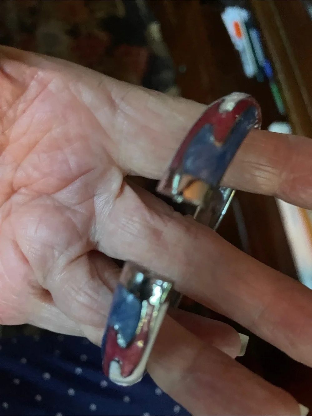 Gorgeous enamel and metal bracelet. Opens easily